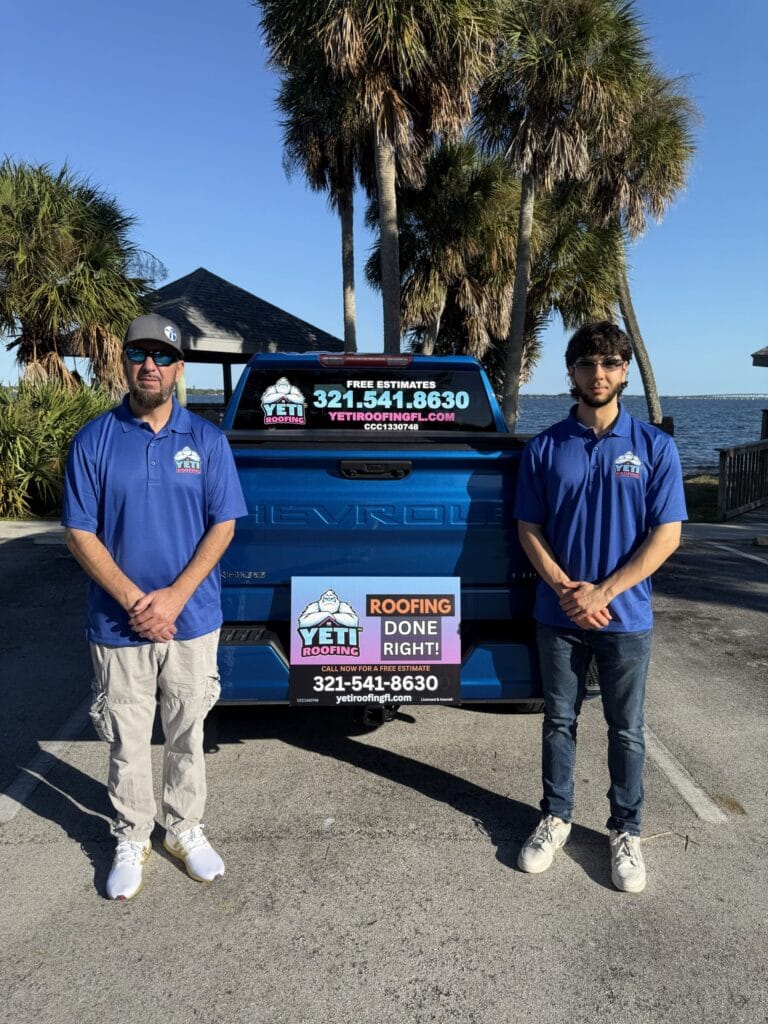 local roofing Owners Justin and Cosmin standing in front of truck